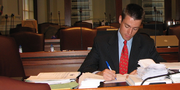 Photo of Bryan at Legislative Desk